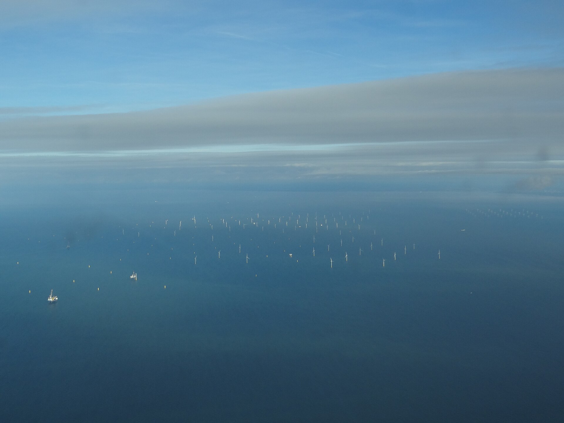 Aerial view of the Gwynt y Môr offshore wind farm off North Wales, with turbines spread across the sea