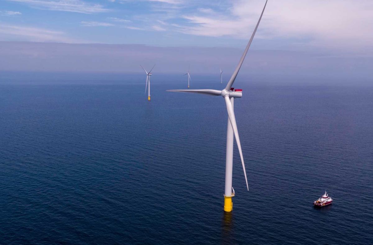 Turbines at the Kriegers Flak offshore wind farm with a crew transfer vessel