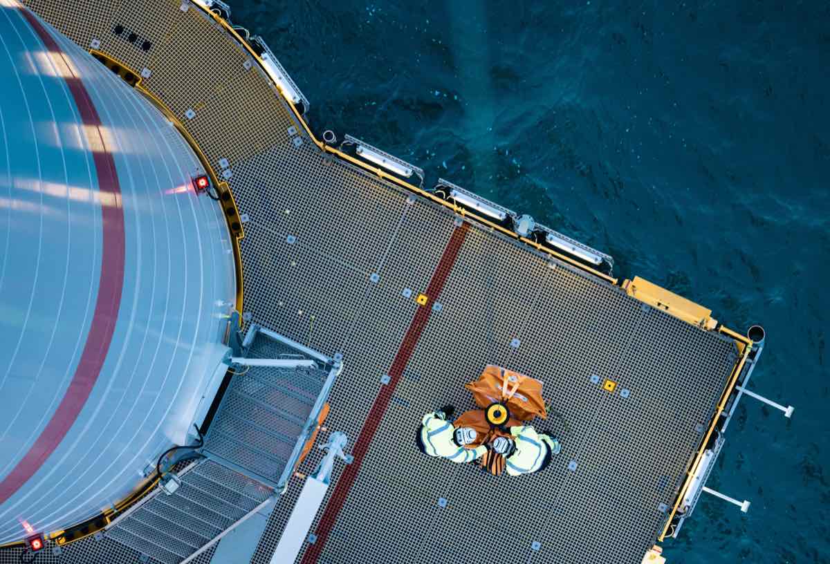 Technicians on a turbine transition-piece platform at Veja Mate, seen from above
